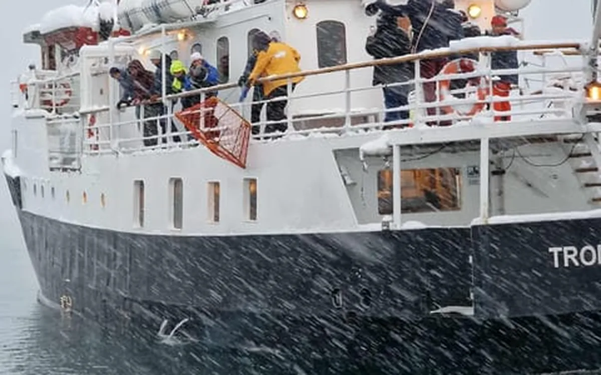 The tour vessel moored at the quay in the middle of Tromsø
